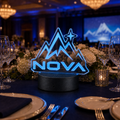 Custom clear die-cut LED acrylic business logo sign used as a corporate gala centerpiece