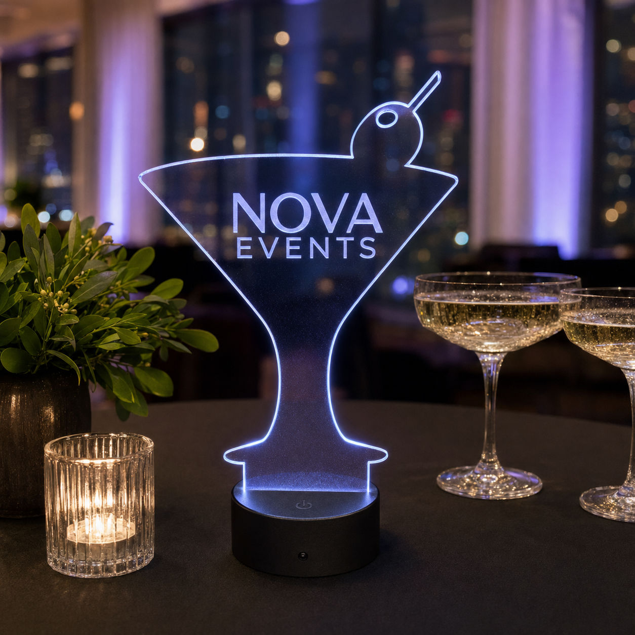 Clear martini-shaped LED acrylic logo sign used at a corporate cocktail event
