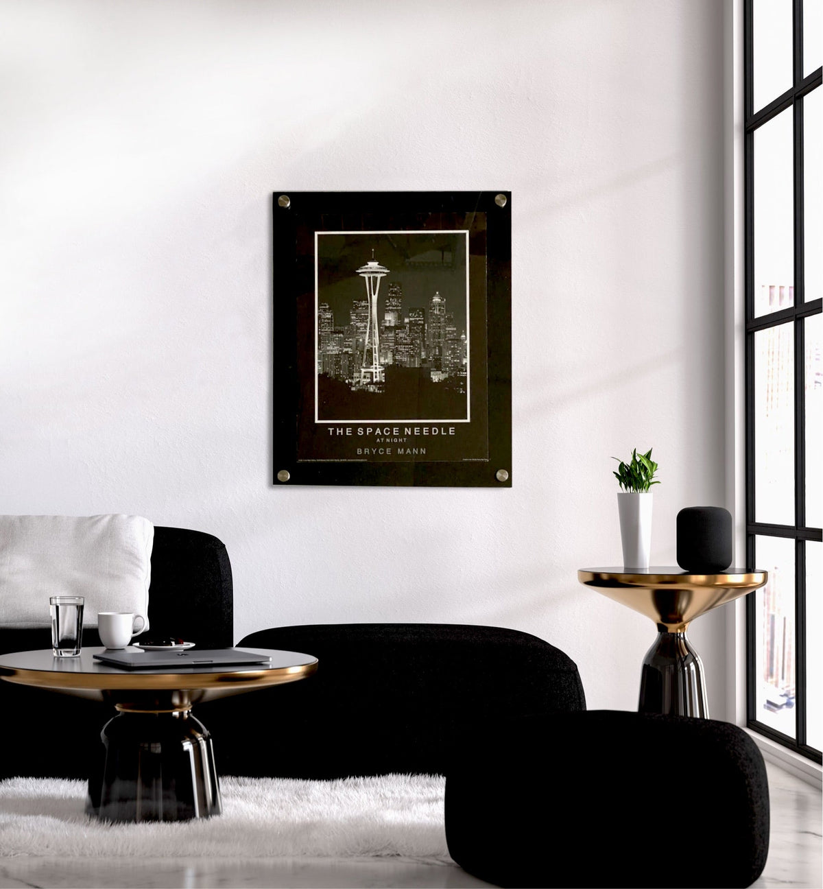 Black backed floating acrylic picture frame with a Space Needle print in a modern living room