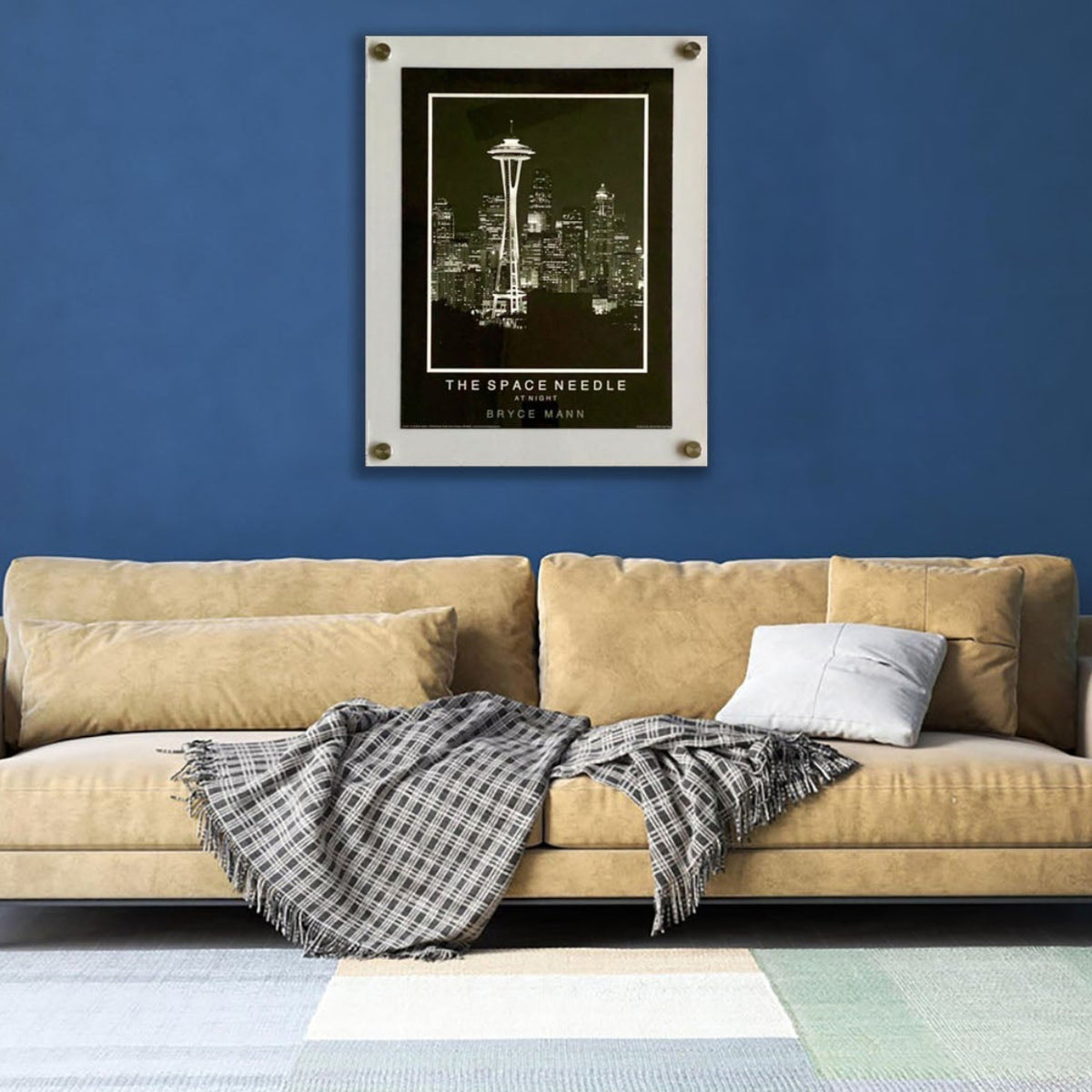 White floating acrylic picture frame holding a botanical print on a navy blue living room wall